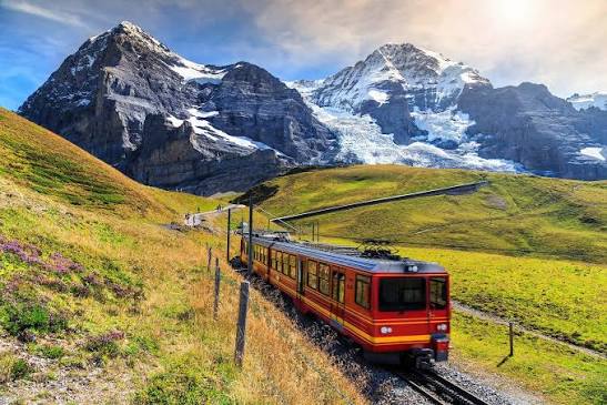 Cogwheel train descends Mount Pilatus with sweeping views over Lake Lucerne.